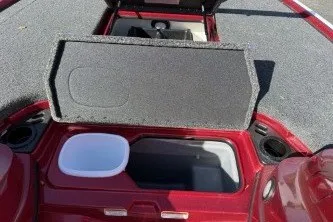 Slide: The Image of 2026 Nitro Z19 XL boat storage compartment with open lid, showcasing interior space. - 12