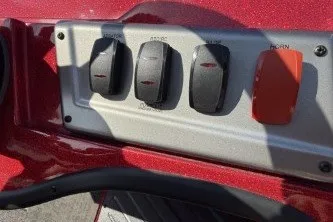 Slide: The Image of Control panel of 2026 Nitro Z19 XL boat with switches and red button. - 9