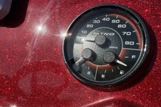 Slide: The Image of Close-up of 2026 Nitro Z19 XL speedometer on glittery red dashboard. - 10