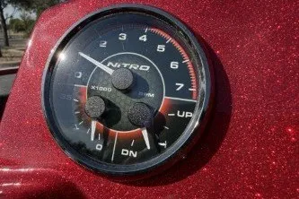 Slide: The Image of Tachometer of 2026 Nitro Z19 XL boat, red glitter finish, close-up view. - 11