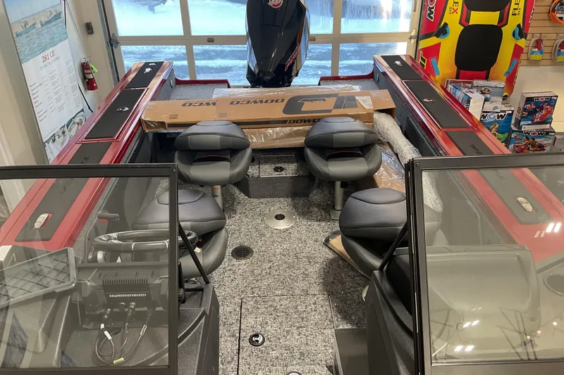 Slide: The Image of 2026 Tracker Targa V-19 Combo boat interior with seating and carpeted deck. - 11