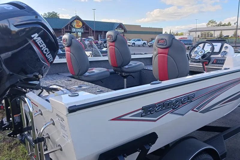 Slide: The Image of 2026 Ranger VS1682SC Angler boat with Mercury engine, parked outdoors. - 3