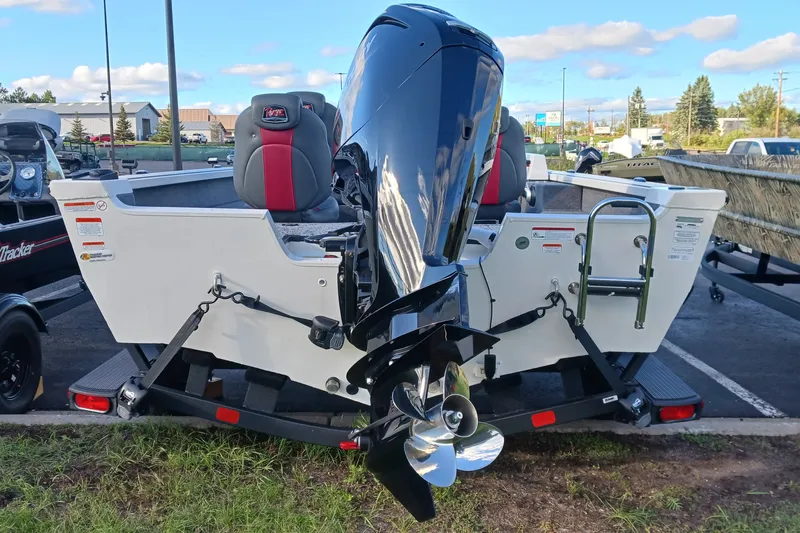 Slide: The Image of 2026 Ranger VS1682SC Angler boat with powerful outboard motor in parking lot. - 2