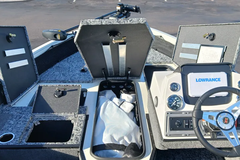 Slide: The Image of 2026 Ranger VS1682SC Angler boat interior with storage compartments and Lowrance electronics. - 8