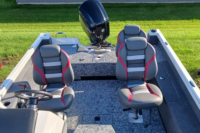 Slide: The Image of 2026 Ranger VS1682SC Angler boat interior with two cushioned seats and motor. - 5