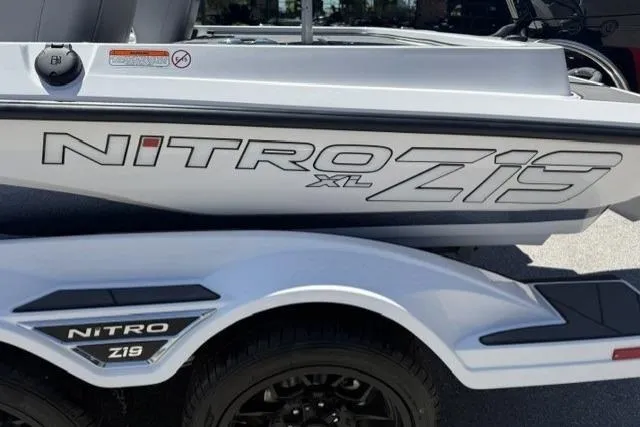 Slide: The Image of 2026 Nitro Z19 XL boat on trailer, showcasing sleek design and branding. - 87