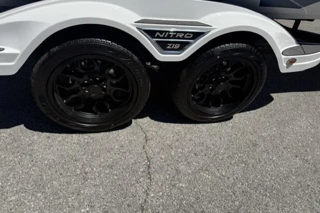 Slide: The Image of 2026 Nitro Z19 XL trailer with sleek black wheels on a sunny day. - 6