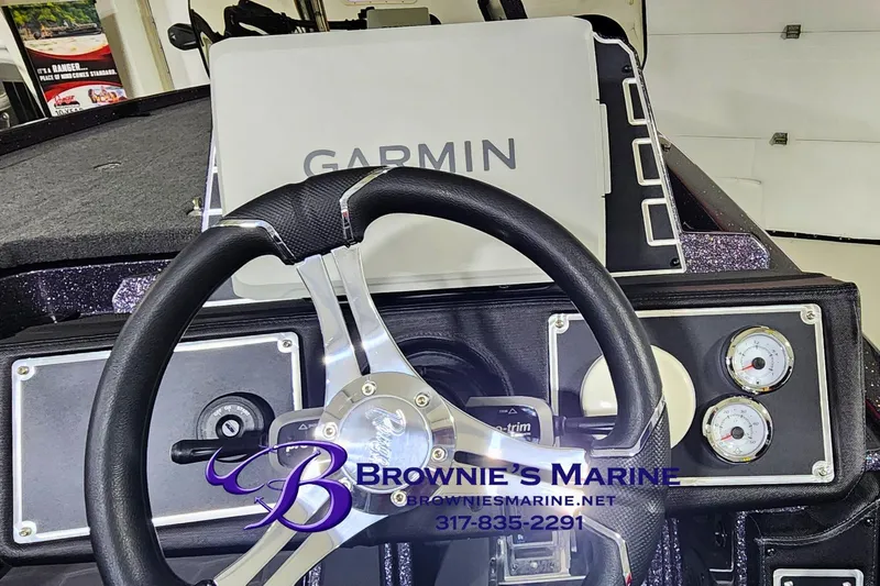 Slide: The Image of 2026 Ranger Z521 boat dashboard with Garmin GPS and steering wheel, Brownie's Marine branding. - 9