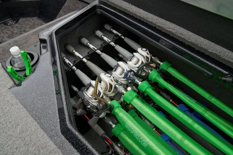 Slide: The Image of Red Nitro Z20 XL Pro 2026 boat storage compartment with open lid and cup holders. - 27