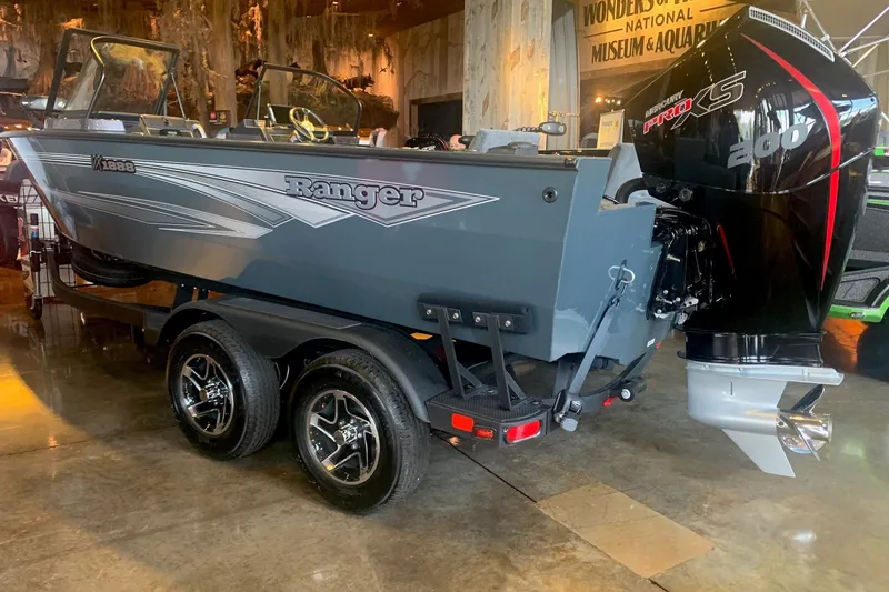 The Image of 2026 Ranger VX1888 WT boat with Mercury Pro XS 200 engine on display indoors. - 0