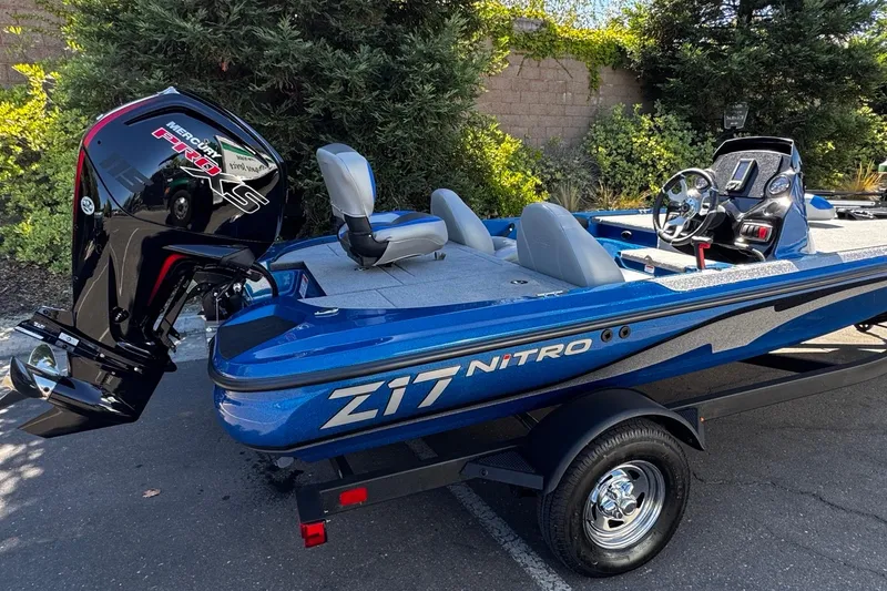 Slide: The Image of 2026 Nitro Z17 boat with Mercury Pro XS engine, parked outdoors. - 4