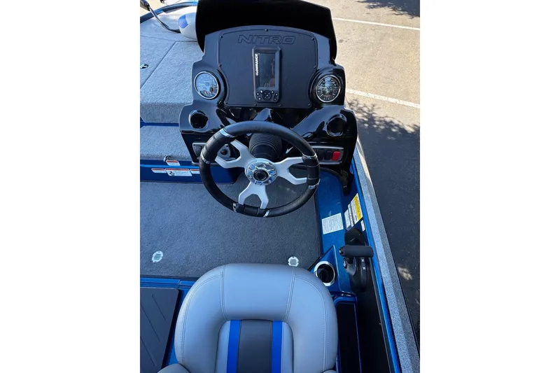 Slide: The Image of 2026 Nitro Z17 boat dashboard with steering wheel and control panel. - 9