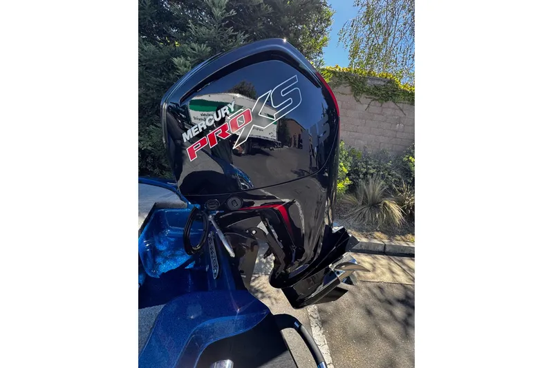 Slide: The Image of Mercury Pro XS outboard motor on a 2026 Nitro Z17 boat, parked outdoors. - 10