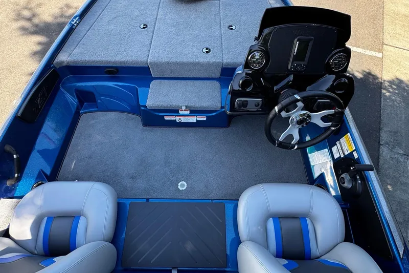 Slide: The Image of Interior of a 2026 Nitro Z17 boat with steering wheel and seating. - 8