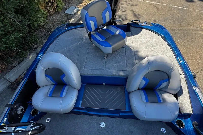 Slide: The Image of 2026 Nitro Z17 boat interior with gray and blue seating, showcasing modern design. - 7