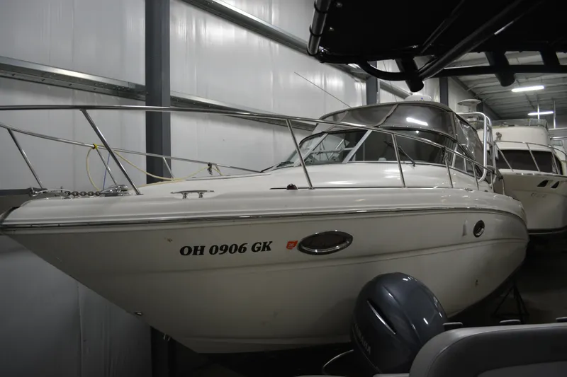The Image of 2006 Sea Ray 290 Amberjack boat in indoor storage, side view. - 0