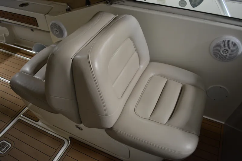 Slide: The Image of 2006 Sea Ray 290 Amberjack boat interior with beige leather seating. - 15