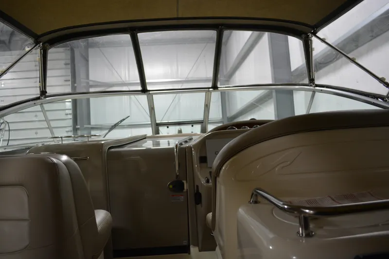 Slide: The Image of Interior view of 2006 Sea Ray 290 Amberjack boat cockpit with steering and seating. - 17