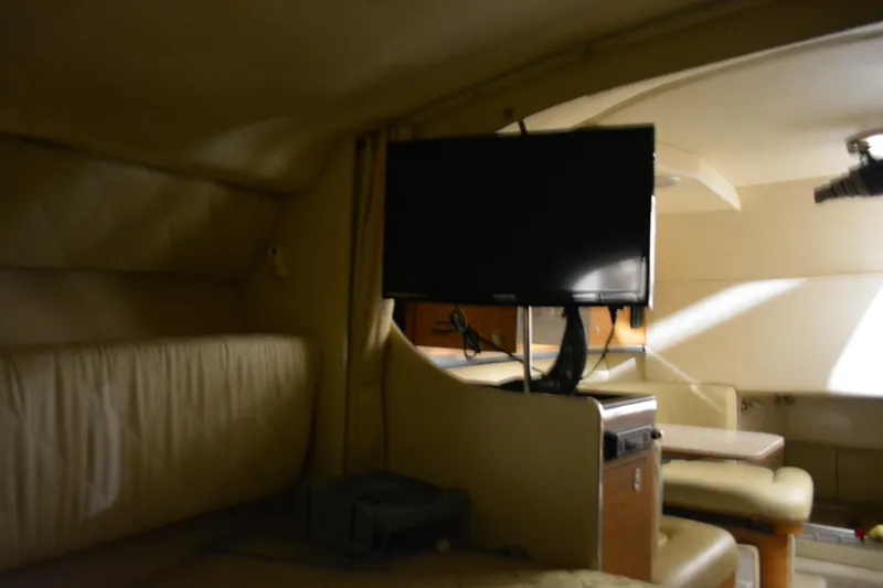 Slide: The Image of Interior of 2006 Sea Ray 290 Amberjack with TV and seating area. - 24