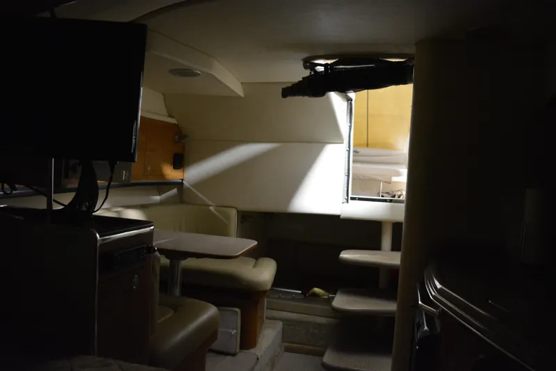 Slide: The Image of Interior of 2006 Sea Ray 290 Amberjack boat with seating and table. - 25