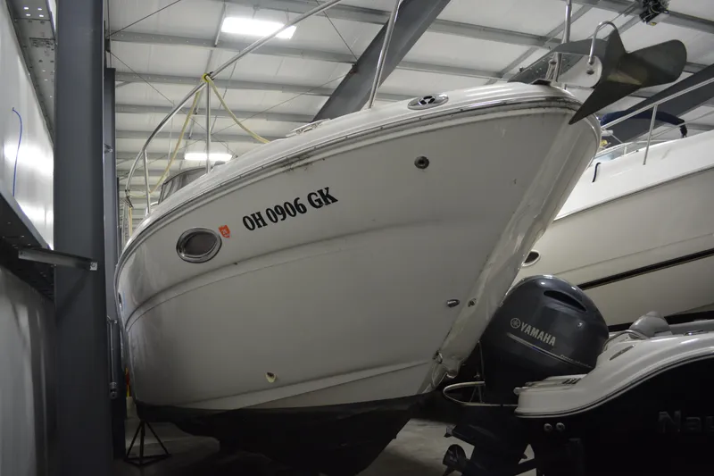 Slide: The Image of 2006 Sea Ray 290 Amberjack boat stored indoors with Yamaha engine. - 3