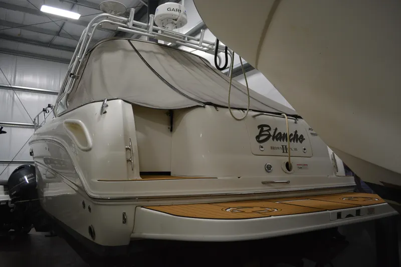 Slide: The Image of 2006 Sea Ray 290 Amberjack boat in storage, rear view with covered deck. - 5