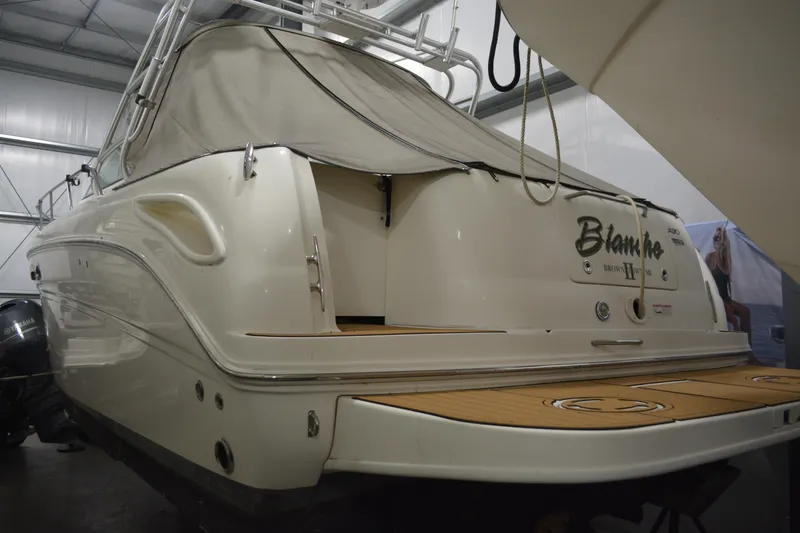 Slide: The Image of 2006 Sea Ray 290 Amberjack boat in storage, rear view with covered deck. - 6