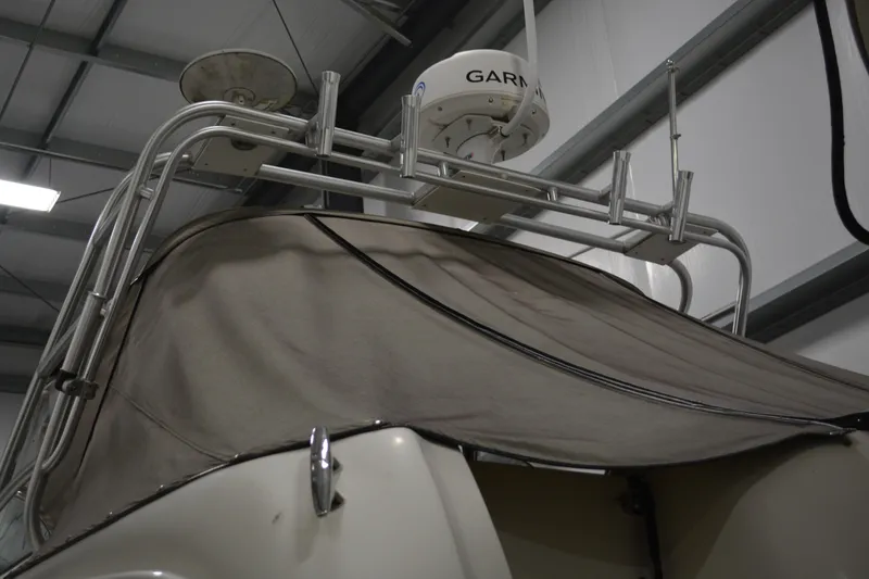 Slide: The Image of 2006 Sea Ray 290 Amberjack with Garmin radar, covered in a storage facility. - 8