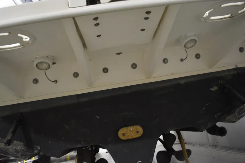 Slide: The Image of 2006 Sea Ray 290 Amberjack boat hull and propeller detail in a storage facility. - 9