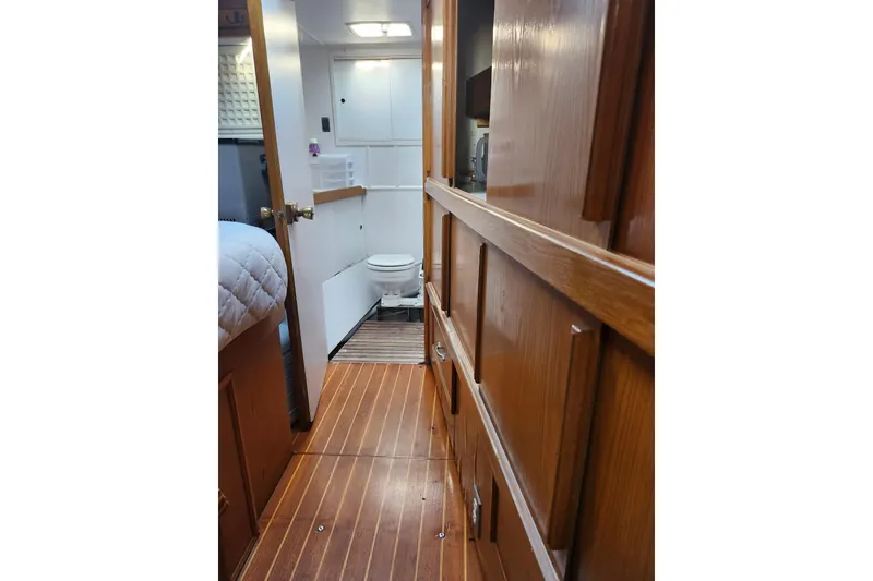 Slide: The Image of Interior of 1987 Gilbert Caroff Exploration yacht with wooden flooring and compact bathroom. - 27