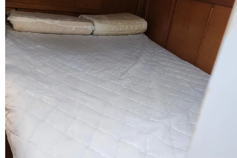 Slide: The Image of Interior cabin of 1987 Gilbert Caroff Exploration with bed and wooden paneling. - 32