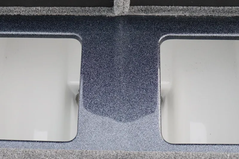 Slide: The Image of 2026 Phoenix 721 ZXL boat interior with dual storage compartments, sleek design. - 12