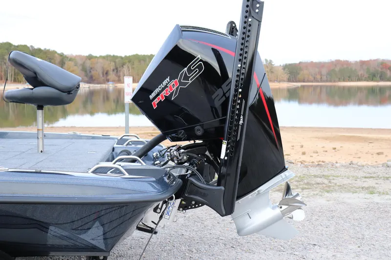 Slide: The Image of 2026 Phoenix 721 ZXL boat with Mercury Pro XS engine by a lake. - 16