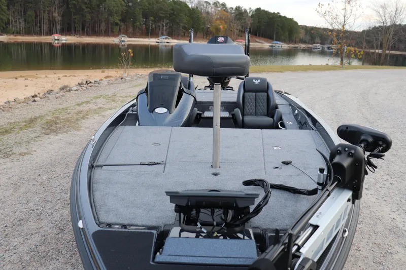 Slide: The Image of 2026 Phoenix 721 ZXL fishing boat on a lakeside gravel path. - 2