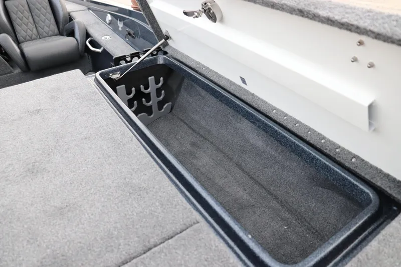 Slide: The Image of 2026 Phoenix 721 ZXL boat interior with open storage compartment and seating. - 4