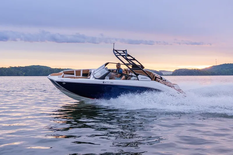 Slide: The Image of Manufacturer Provided Image: 2026 Yamaha Boats 222SE cruising on a serene lake at sunset. - 2