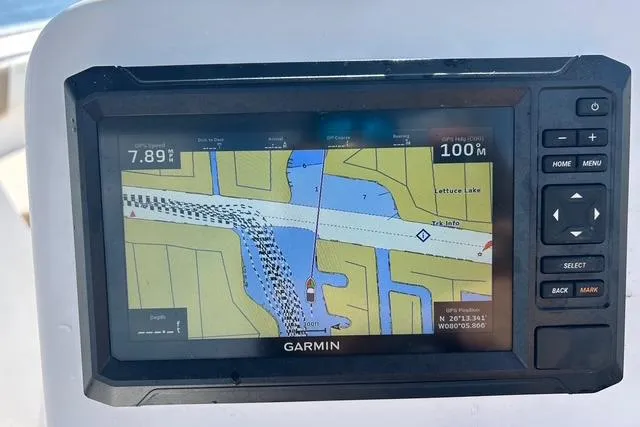Slide: The Image of Garmin navigation display on 2018 Pro-Line 23 Dual Console boat, showing map and coordinates. - 10