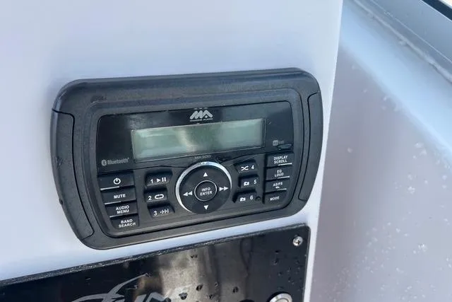 Slide: The Image of 2018 Pro-Line 23 Dual Console boat stereo system with Bluetooth connectivity. - 12