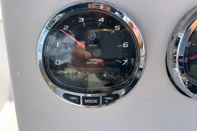 Slide: The Image of Close-up of a 2018 Pro-Line 23 Dual Console boat tachometer displaying RPM and voltage. - 16