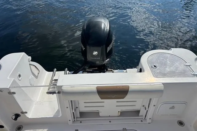 Slide: The Image of 2018 Pro-Line 23 Dual Console boat with Mercury outboard motor on water. - 20