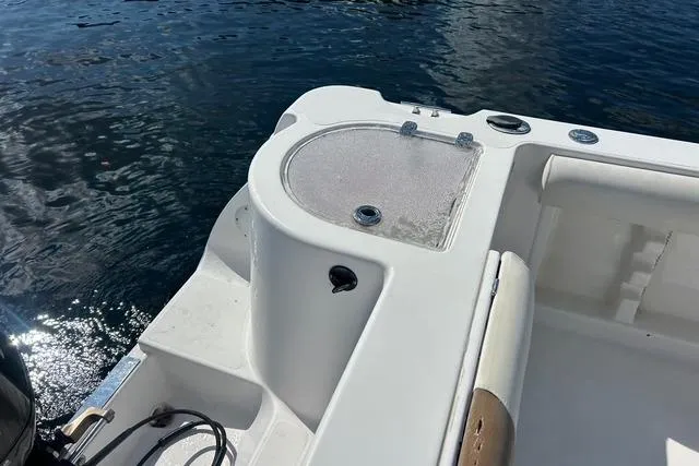 Slide: The Image of 2018 Pro-Line 23 Dual Console boat, featuring a clean deck and water view. - 22