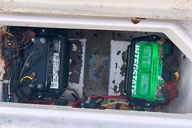 Slide: The Image of Battery compartment of 2018 Pro-Line 23 Dual Console boat with Interstate batteries. - 25