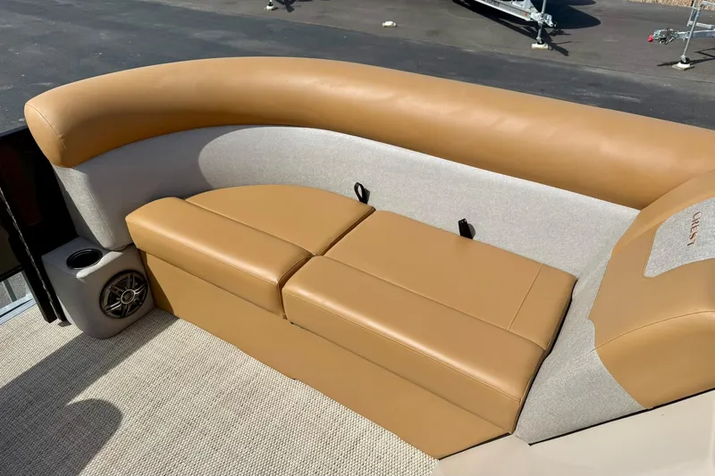 Slide: The Image of 2026 Crest Conquest SE 200 Fish boat with tan seating and integrated speaker. - 13