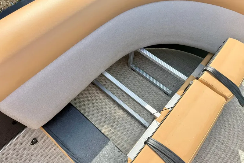 Slide: The Image of 2026 Crest Conquest SE 200 Fish boat seating with tan and gray upholstery. - 16