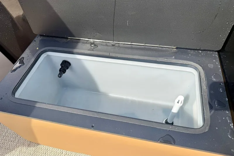 Slide: The Image of Livewell compartment in 2026 Crest Conquest SE 200 Fish boat, featuring drainage and aeration systems. - 31