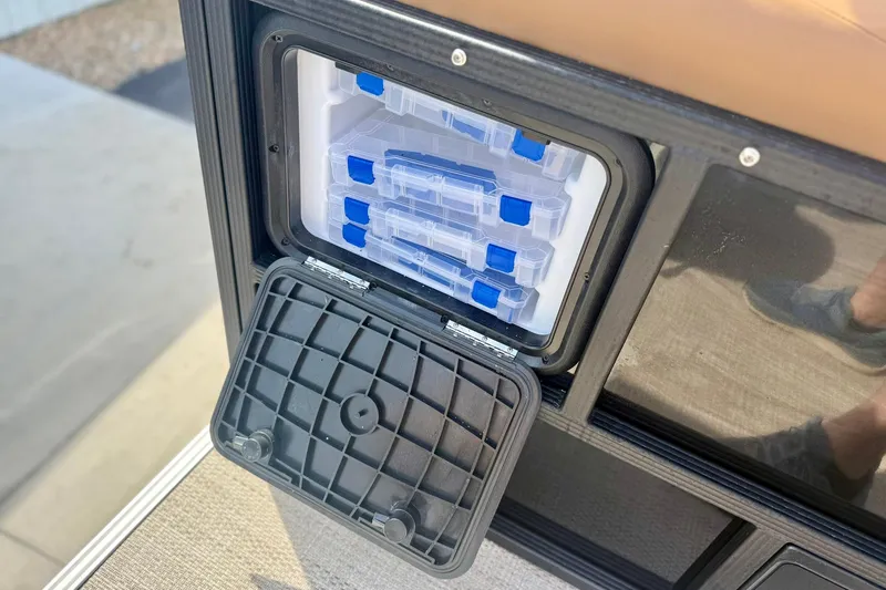 Slide: The Image of Storage compartment with tackle boxes on 2026 Crest Conquest SE 200 Fish boat. - 36