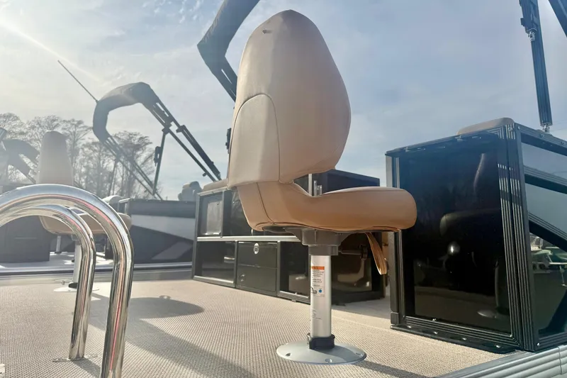 Slide: The Image of 2026 Crest Conquest SE 200 Fish boat interior with tan seating and sleek design. - 39