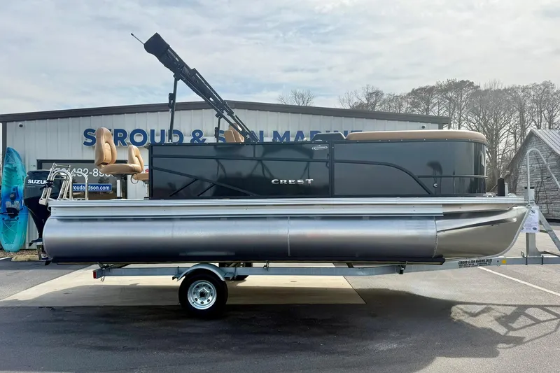 Slide: The Image of 2026 Crest Conquest SE 200 Fish pontoon boat on trailer at dealership. - 8