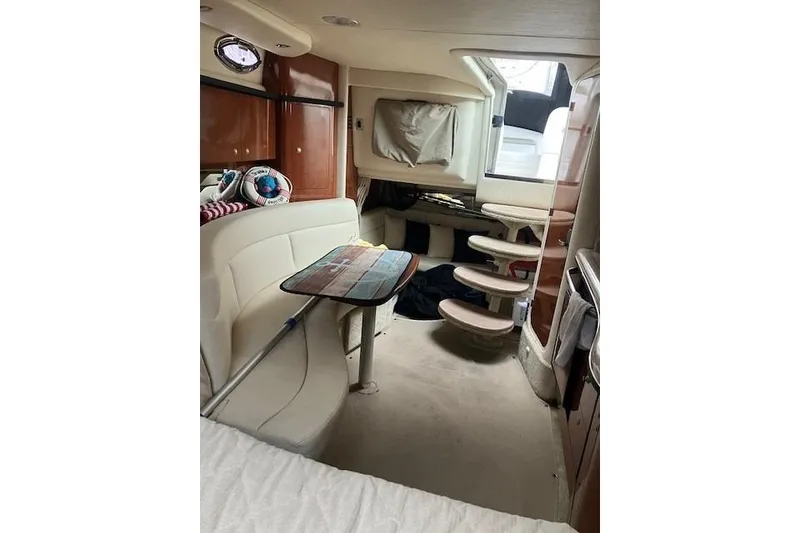 Slide: The Image of Interior of 2007 Sea Ray 320 Sundancer yacht with seating and stairs. - 11
