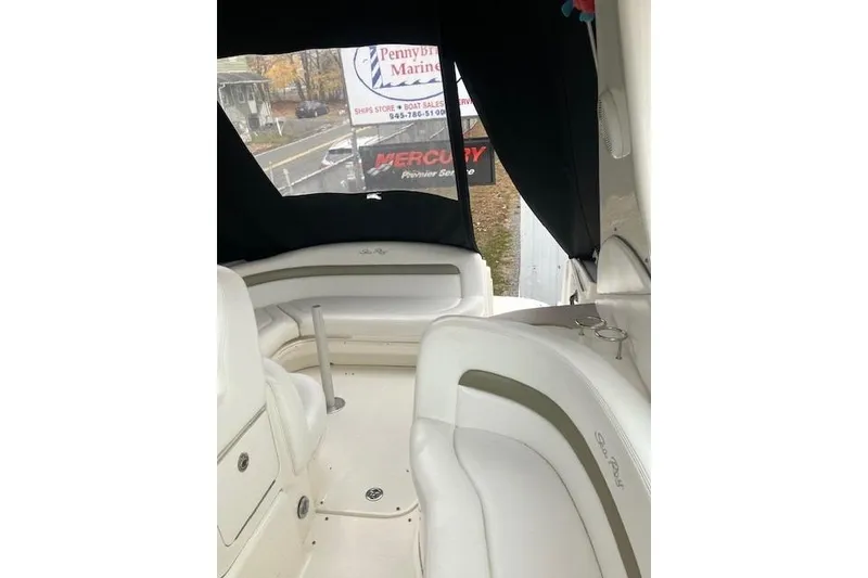 Slide: The Image of Interior view of a 2007 Sea Ray 320 Sundancer boat with seating and canopy. - 8